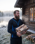 Man carrying firewood on a frosty morning in the black Shieldwall long sleeve